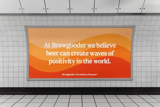 Brewgooder underground billboard reading "At Brewgooder we believe beer can create waves of positivity in the world"