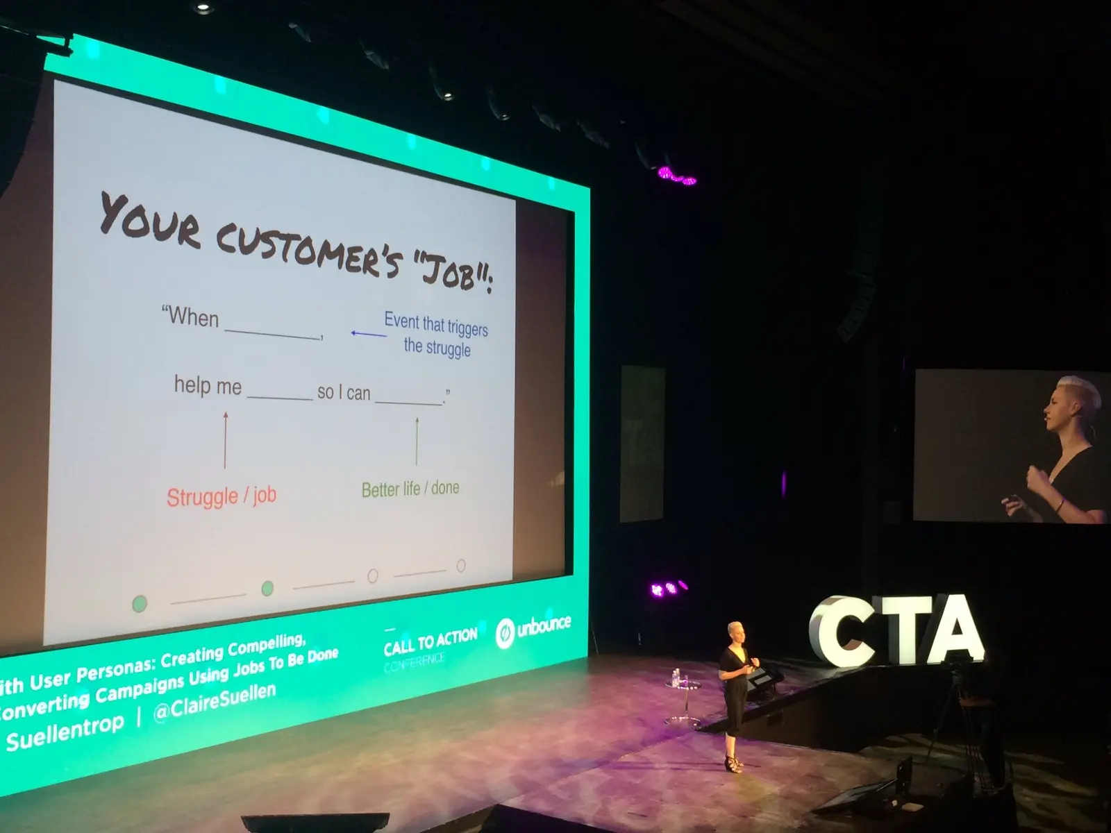 Claire Suellentrop on stage at the CTA conference beside a Jobs To Be Done slide framing a customer's "job"