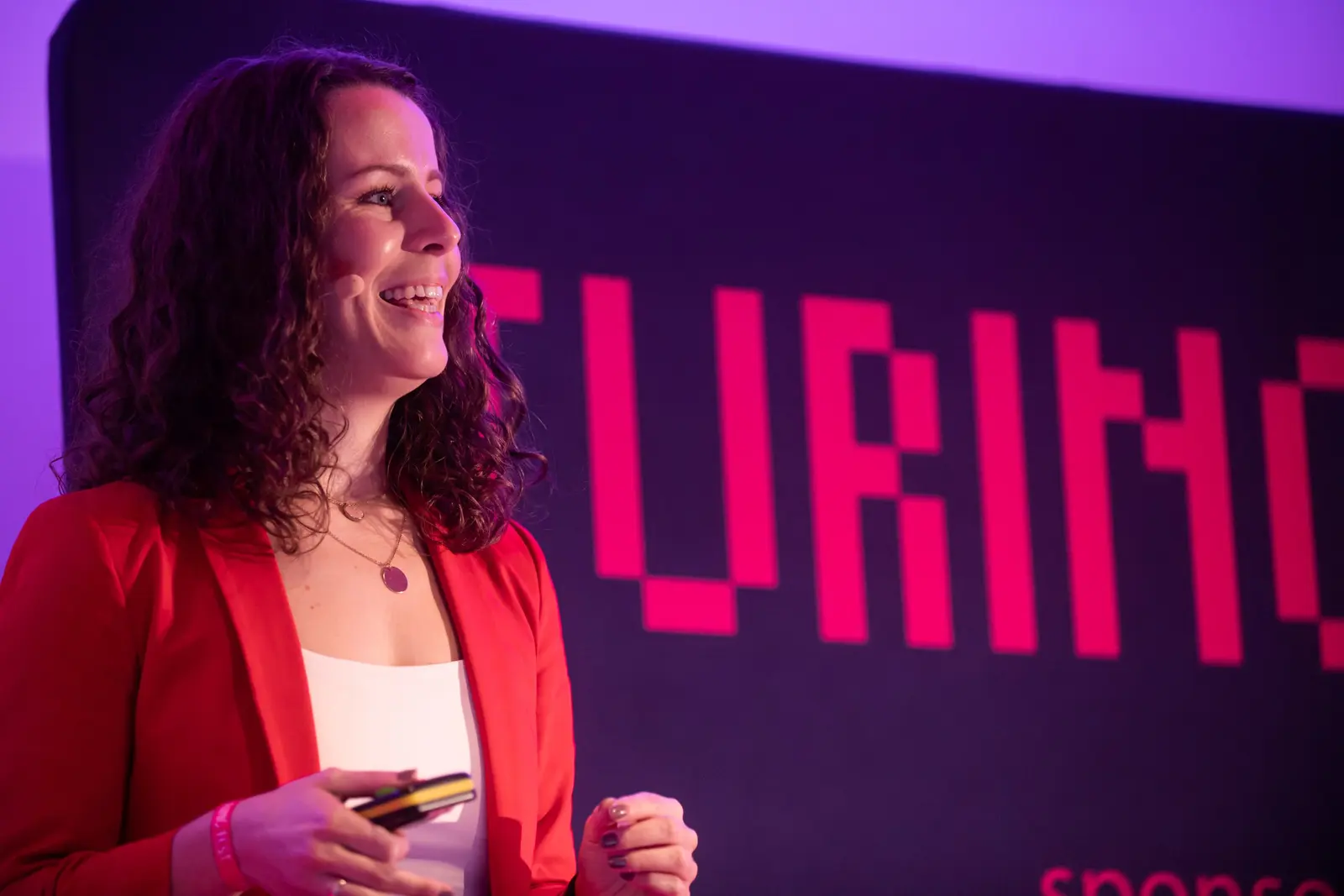 Marijana Kostelac smiling on stage at Turing Fest 2021