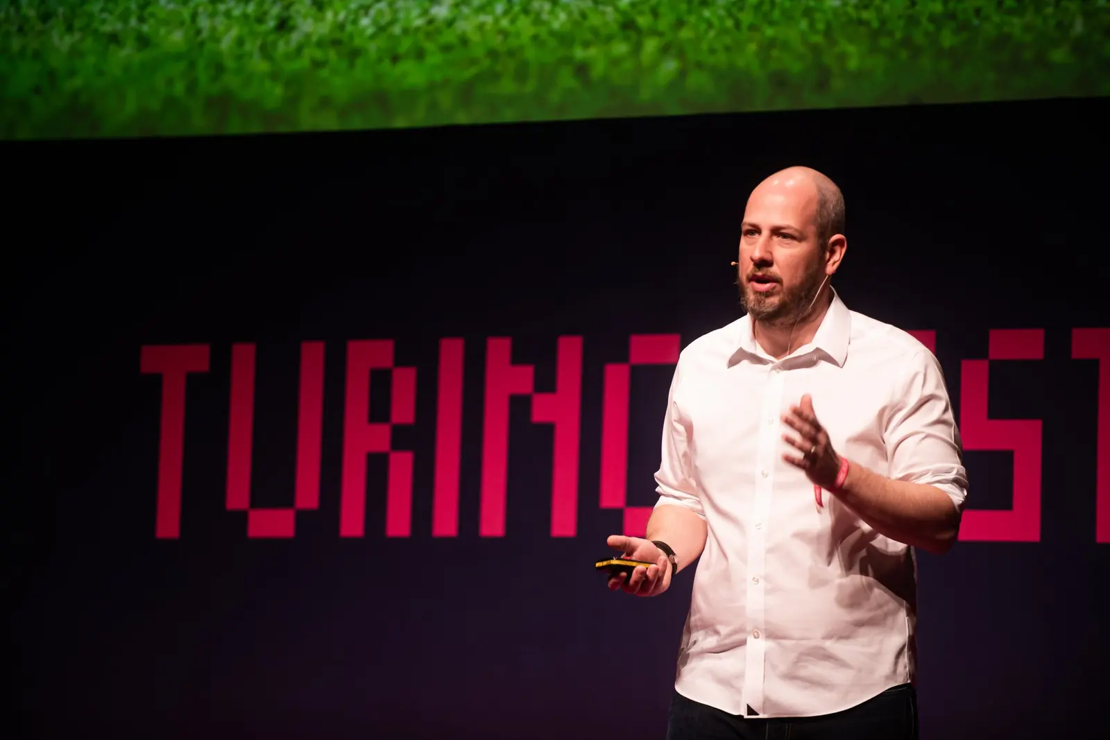 Paddy Moogan of Aira speaking on stage at Turing Fest 2021