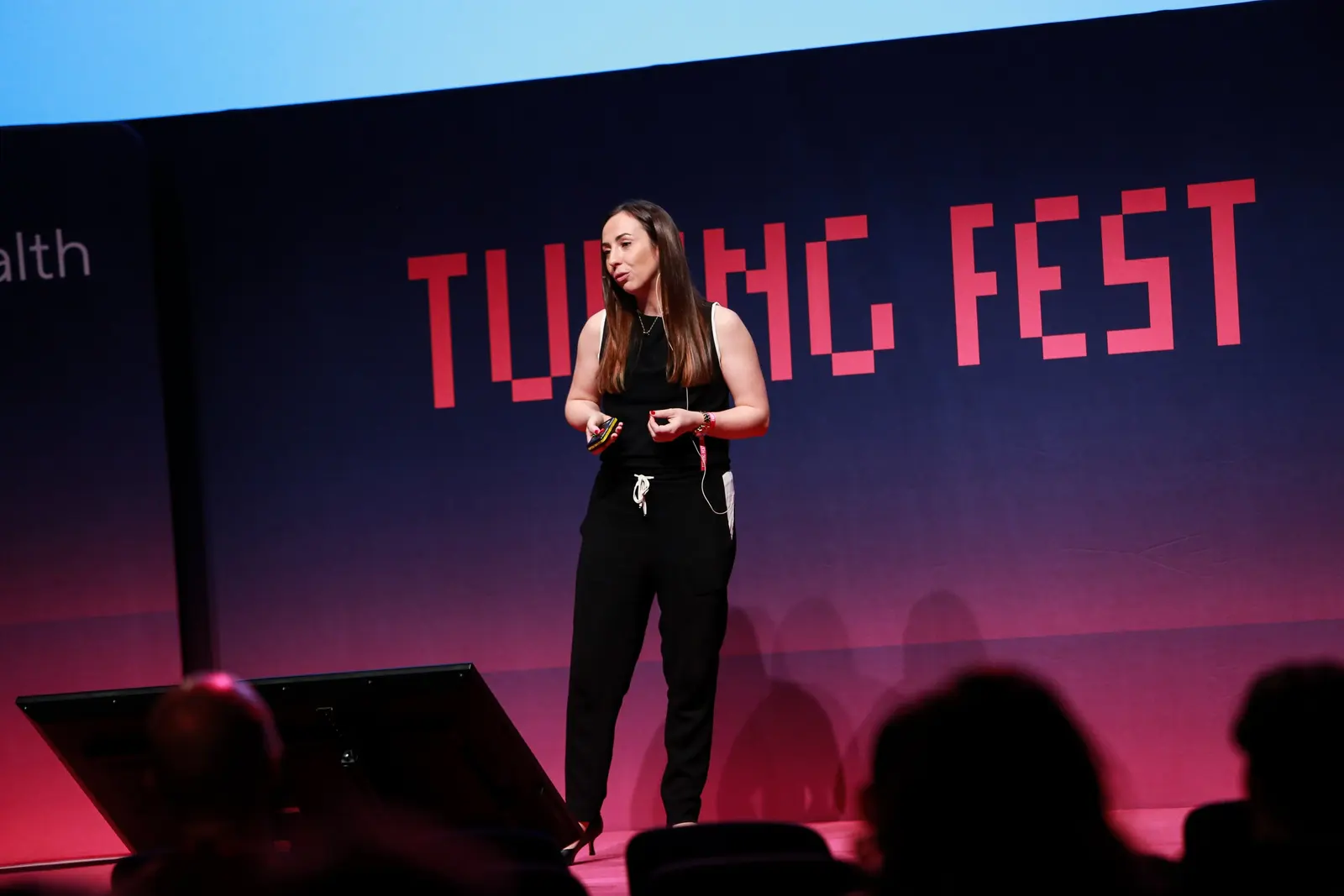 Dr Suzanne Brown speaking on stage at Turing Fest 2021