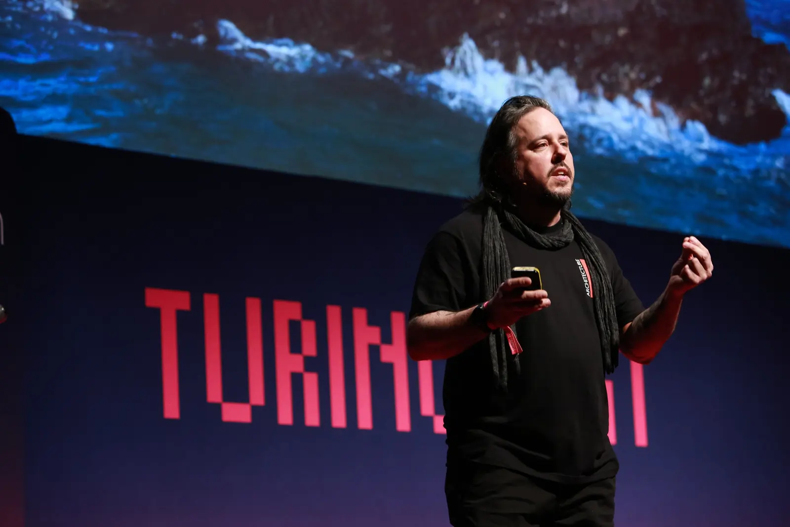 Jason Miller of CreativeX speaking on stage at Turing Fest 2021